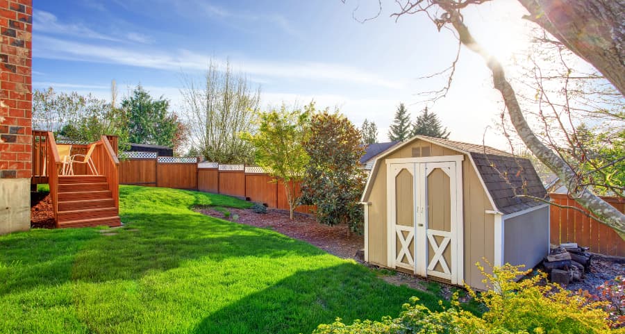 Fenced backyard with storage shed in Evanston